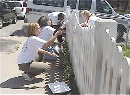 DND staff paint fence to help make Four Corners Shine